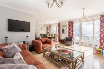 Living Dining area with 2 sets of doors to full length terrace